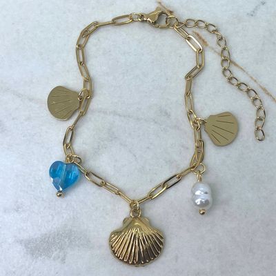 PULSERA ACERO DORADO CON ALMEJAS Y CORAZON DE CRISTAL CELESTE - Imagen 1
