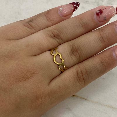 ANILLO ACERO DORADO CORAZON CON ALAS CALADO - Imagen 1