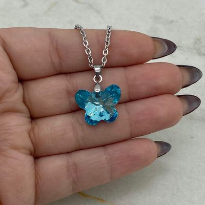 COLLAR CON DIJE CRISTAL - MARIPOSA CELESTE - Imagen 1