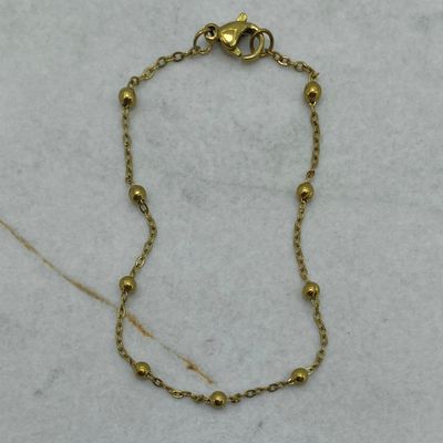 PULSERA ACERO DORADO FINA CON BOLITAS MEDIANAS - Imagen 1