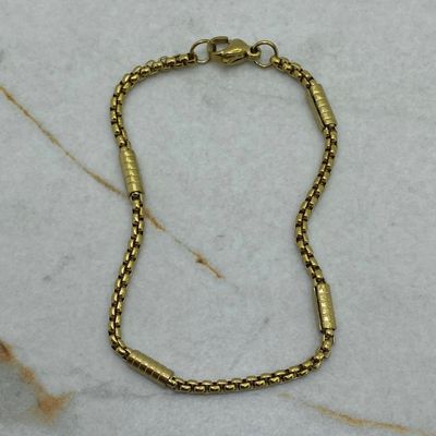 PULSERA ACERO DORADO ROLO CON BARRAS LABRADAS - Imagen 1