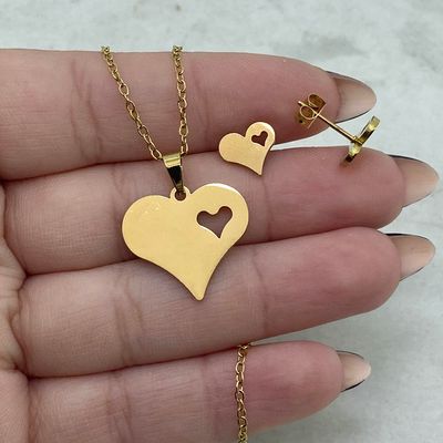 CONJUNTO ACERO DORADO - CORAZON LISO CON CORAZON CALADO - Imagen 1