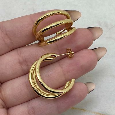 AROS ACERO DORADO PASANTE TRIPLE LINEA CURVA - Imagen 1