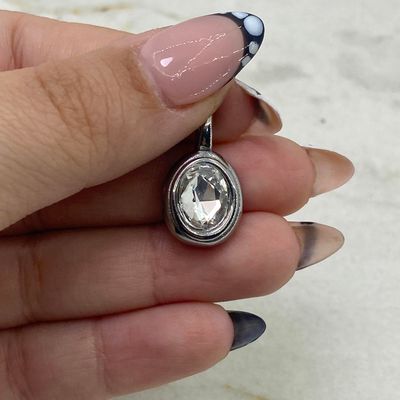 DIJE OVALADO MACIZO CON CRISTAL - BLANCO - Imagen 1