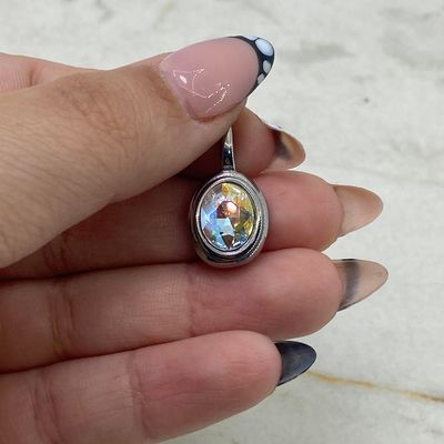 DIJE OVALADO MACIZO CON CRISTAL - TORNASOL CLARO - Imagen 1