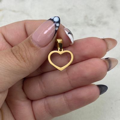 DIJE ACERO DORADO CORAZON CALADO - Imagen 1