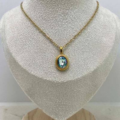 COLLAR ACERO DORADO DIJE OVALADO MACIZO CON CRISTAL -  CELESTE - Imagen 1